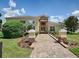 Inviting clubhouse with brick pathway and manicured landscaping, perfect for community gatherings and events at 12340 Ne 48Th Loop, Oxford, FL 34484