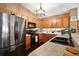 Modern kitchen with stainless steel appliances, ample counter space, and stylish cabinetry for a gourmet experience at 12340 Ne 48Th Loop, Oxford, FL 34484