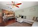Open-concept living area with modern furnishings, connecting seamlessly to the dining and kitchen spaces at 12340 Ne 48Th Loop, Oxford, FL 34484