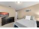 Relaxing bedroom with carpet, and a TV with dresser offer a comfortable place to rest at 13045 Colonnade Cir, Clermont, FL 34711