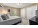 Comfortable bedroom features carpet, double closets, and a window for natural light, providing ample space at 13045 Colonnade Cir, Clermont, FL 34711