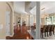 Elegant dining room features a modern light fixture and hardwood floors, creating an inviting atmosphere at 13045 Colonnade Cir, Clermont, FL 34711
