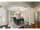 Elegant dining room features a large window and dark wood table, perfect for entertaining at 13045 Colonnade Cir, Clermont, FL 34711