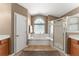 Inviting main bathroom features a soaking tub, large window and a separate glass enclosed shower at 13045 Colonnade Cir, Clermont, FL 34711