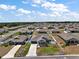 An aerial view of the property in a neighborhood with blue property outline at 13328 Lake Yale View Loop, Grand Island, FL 32735