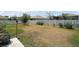 Spacious backyard featuring a white fence, grass, and potential for outdoor activities at 13328 Lake Yale View Loop, Grand Island, FL 32735