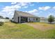 A beautiful backyard featuring a screened patio and well-maintained lawn at 13328 Lake Yale View Loop, Grand Island, FL 32735