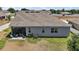 Spacious backyard featuring a patio, lush lawn, and privacy fence at 13328 Lake Yale View Loop, Grand Island, FL 32735