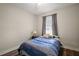 Cozy bedroom featuring a comfortable bed and natural light at 13328 Lake Yale View Loop, Grand Island, FL 32735