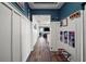 Elegant hallway with hardwood floors, board and batten walls, and stylish decor at 13328 Lake Yale View Loop, Grand Island, FL 32735