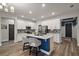 Bright kitchen featuring an island with seating, modern appliances, and ample cabinet space at 13328 Lake Yale View Loop, Grand Island, FL 32735