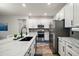 Well-lit kitchen featuring an eat-in marble island, stainless steel appliances, and ample counter space at 13328 Lake Yale View Loop, Grand Island, FL 32735