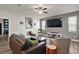 Spacious living room featuring contemporary decor, ample seating, and a large flat-screen television at 13328 Lake Yale View Loop, Grand Island, FL 32735