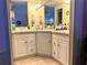 Bathroom featuring and sinks, neutral countertop, and a large mirror at 1616 Lauren Ln, Lady Lake, FL 32159