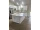 Beautiful kitchen with a center island, sleek appliances, and ample counter space at 16487 Sw 55Th, Ocala, FL 34473