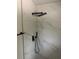 Elegant shower with tiled walls, rainfall shower head, and sleek fixtures at 16487 Sw 55Th, Ocala, FL 34473