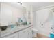 Bathroom featuring a granite countertop, updated fixtures, and a shower and tub combo at 17076 Se 96Th Chapelwood Cir, The Villages, FL 32162