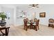 Dining area featuring a glass-top table with seating for four and an open floor plan at 17076 Se 96Th Chapelwood Cir, The Villages, FL 32162