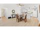 The home's dining area shows an open-concept space with an eat-in kitchen at 17076 Se 96Th Chapelwood Cir, The Villages, FL 32162