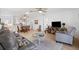 Open living area features neutral decor and easy access to dining area and kitchen at 17076 Se 96Th Chapelwood Cir, The Villages, FL 32162