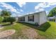 A peaceful backyard with a well-maintained lawn, manicured shrubs, and neat landscaping, perfect for outdoor enjoyment at 1709 Betrillo Ct, The Villages, FL 32162