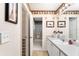 Well-lit bathroom featuring a walk-in shower and ample cabinet space at 1709 Betrillo Ct, The Villages, FL 32162