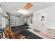 Spacious two-car garage offering ample storage, lighting and an entry door to the home at 1709 Betrillo Ct, The Villages, FL 32162