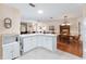 Open kitchen featuring a large island that offers ample storage and counter space at 1709 Betrillo Ct, The Villages, FL 32162