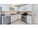 Kitchen featuring stainless steel appliances and light gray countertops at 1709 Betrillo Ct, The Villages, FL 32162