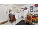 Laundry room with washer, dryer, storage cabinet, window and comfortable chairs at 1709 Betrillo Ct, The Villages, FL 32162