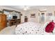 Spacious main bedroom with a view to an ensuite bathroom and dining area at 1709 Betrillo Ct, The Villages, FL 32162
