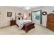 Comfortable main bedroom with natural light and a ceiling fan at 1709 Betrillo Ct, The Villages, FL 32162