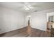 Open bedroom with wood floors and easy access to ensuite bath at 17238 Se 94Th Coults Cir, The Villages, FL 32162