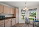 Inviting kitchen features a breakfast nook area with great natural light and palm tree views at 17238 Se 94Th Coults Cir, The Villages, FL 32162