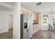 Spacious eat-in kitchen with stainless steel refrigerator and lots of natural light at 17238 Se 94Th Coults Cir, The Villages, FL 32162
