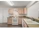 Clean kitchen with light wood cabinets and modern appliances at 17238 Se 94Th Coults Cir, The Villages, FL 32162