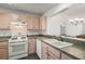 Bright kitchen featuring updated countertops, stainless steel appliances, and plenty of cabinet space at 17238 Se 94Th Coults Cir, The Villages, FL 32162