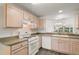 Bright kitchen featuring updated countertops, stainless steel appliances, and breakfast bar at 17238 Se 94Th Coults Cir, The Villages, FL 32162