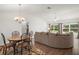 Inviting living room with wood floors and bright windows at 17238 Se 94Th Coults Cir, The Villages, FL 32162