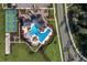 Aerial view of the community pool, tennis courts, and amenity center at 17386 Blazing Star Cir, Clermont, FL 34714