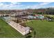 Aerial view of the community center featuring a pool, bocce ball and pickle ball courts at 17386 Blazing Star Cir, Clermont, FL 34714