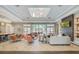 Spacious clubhouse featuring ample seating, a fireplace, and a kitchenette at 17386 Blazing Star Cir, Clermont, FL 34714