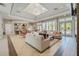 Inviting clubhouse lounge area with comfortable seating, modern decor, and plenty of natural light at 17386 Blazing Star Cir, Clermont, FL 34714