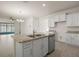 Spacious kitchen featuring granite countertops and stainless steel appliances at 17386 Blazing Star Cir, Clermont, FL 34714