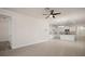 Open-concept living space connecting to the kitchen with granite counters and offering tile flooring throughout at 17386 Blazing Star Cir, Clermont, FL 34714