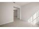 Bright room featuring neutral tile flooring and an open doorway at 17386 Blazing Star Cir, Clermont, FL 34714
