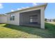 Enjoy outdoor living on this screened patio, perfect for relaxing and entertaining with a grassy backyard at 17386 Blazing Star Cir, Clermont, FL 34714