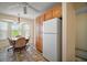 Sunlit breakfast nook with a bay window and adjacent pantry space in the kitchen at 1902 Del Norte Dr, Lady Lake, FL 32159