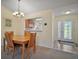 Cozy dining area with a view of the kitchen and front entry, perfect for gatherings at 1902 Del Norte Dr, Lady Lake, FL 32159