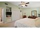 Spacious bedroom features a built-in bookshelf and a comfortable layout, creating a cozy and organized space at 20 Ginger Cir, Leesburg, FL 34748